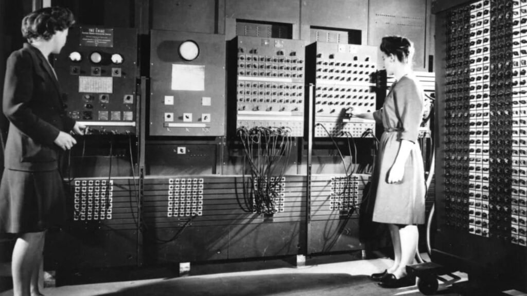 Two women programming the ENIAC computer, the first electronic digital computer, during World War II.