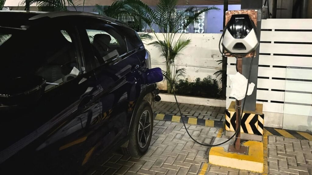 Electric car charging at a public station, illustrating infrastructure and components. Is India ready for electric vehicles?