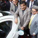 Minister Nitin Gadkari at an electric vehicle charging station, highlighting EV infrastructure in India.