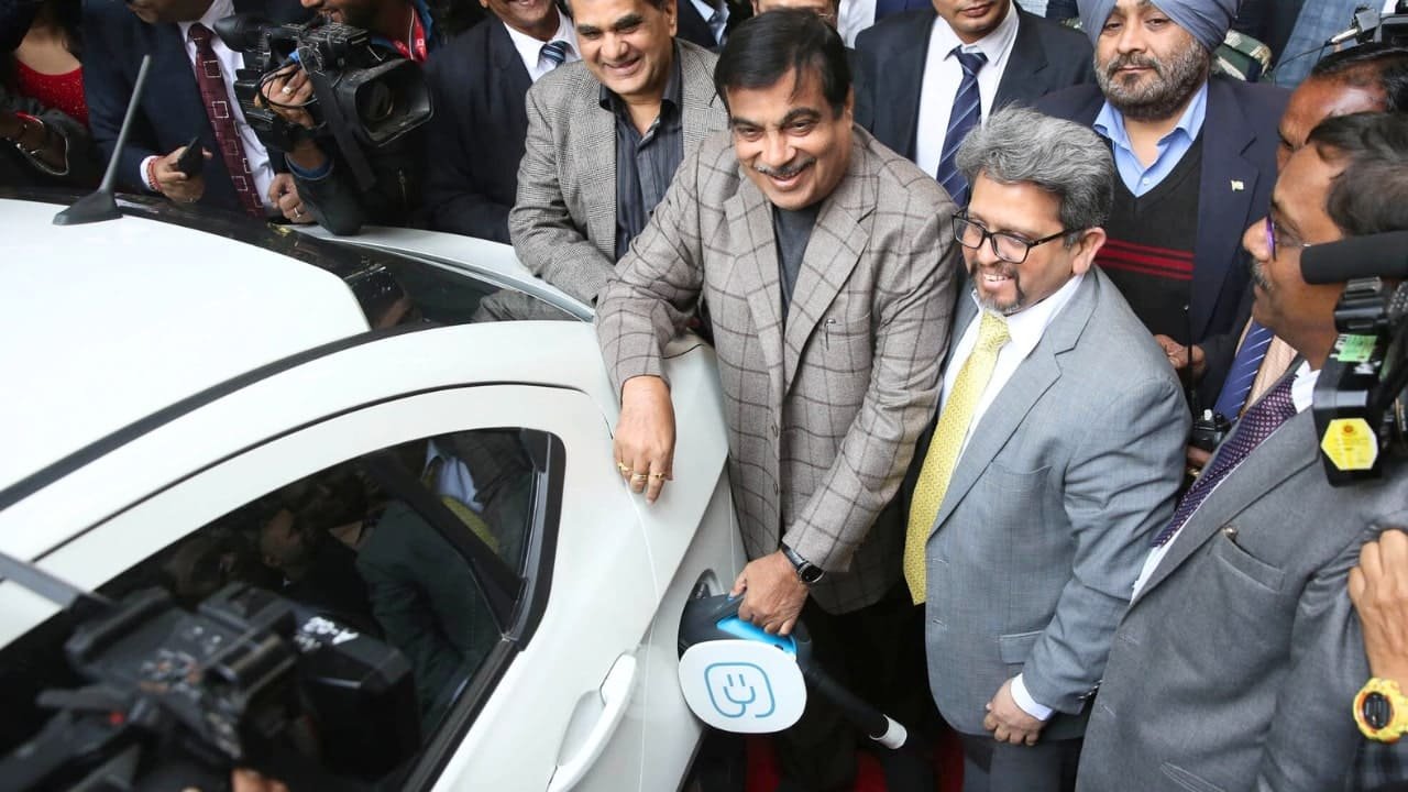 Minister Nitin Gadkari at an electric vehicle charging station, highlighting EV infrastructure in India.