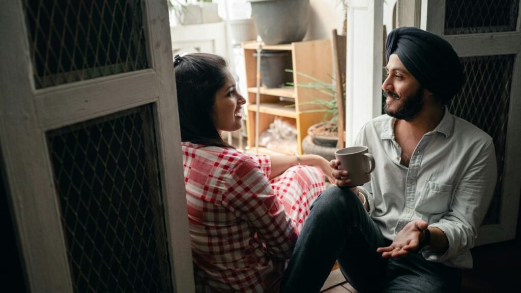 A man and woman having a supportive conversation, showing society's role in combating mental health stigma.