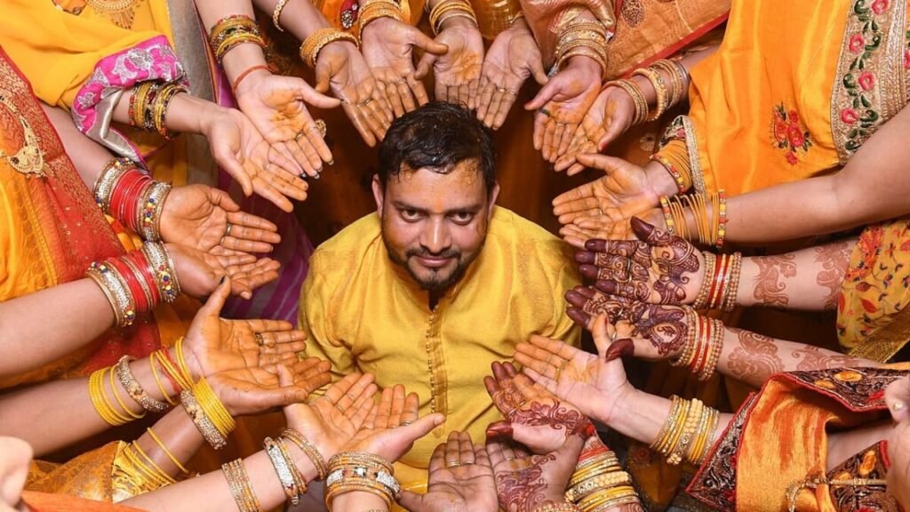 Man surrounded by women, highlighting cultural aspects and stigma in Indian society during men's mental health month.