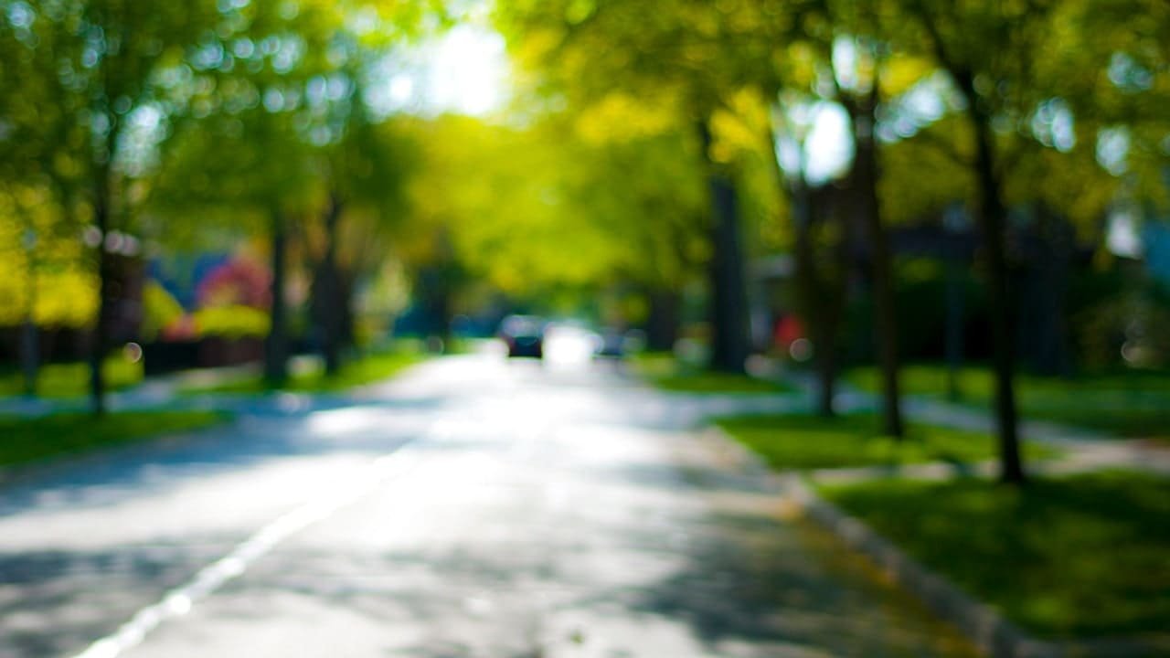 A blurry image of a street, depicting the effects of Myopia on distance vision.