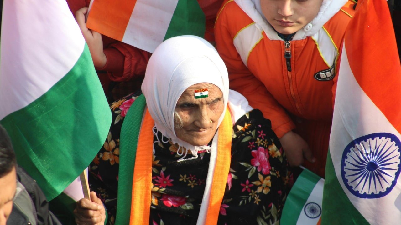 An women with indian flag highlighting the Identity politics in India.