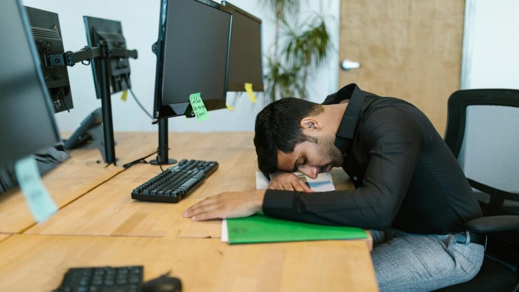 Frustrated Indian man at work, symbolizing stress and male infertility rate in India.